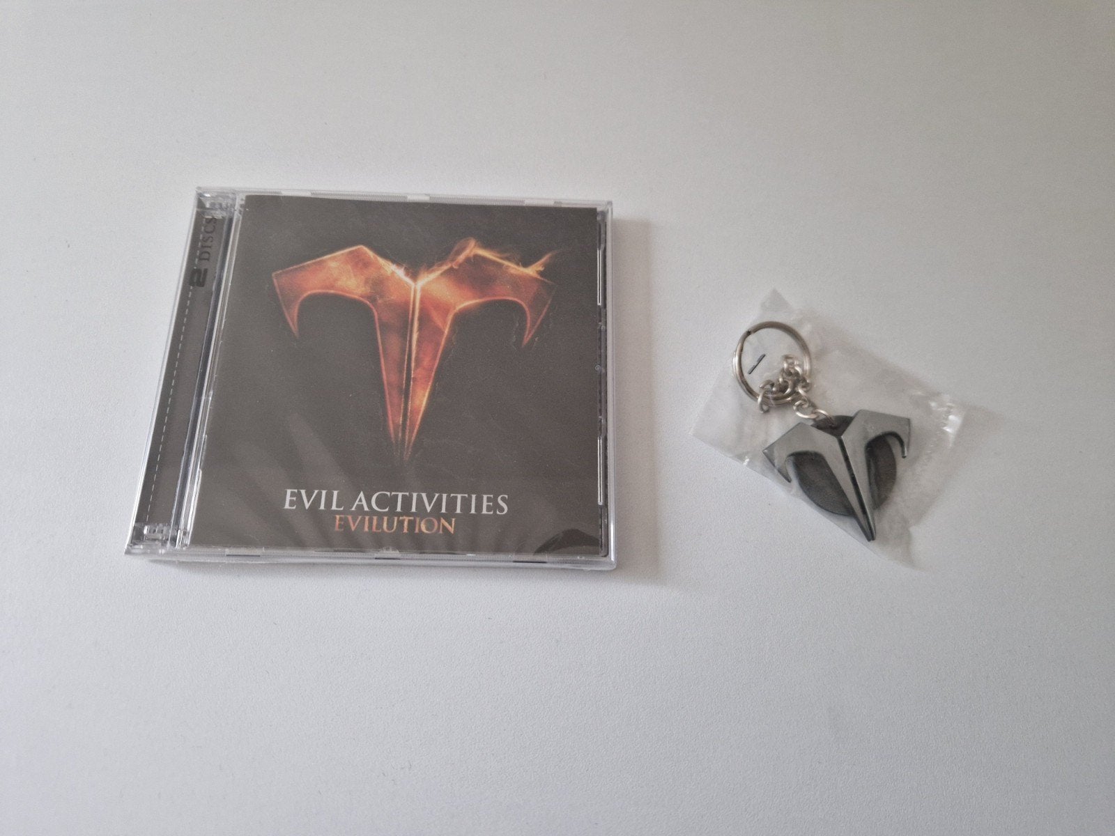 evil activities evolutions cd + sleutel hanger geseald, Verzenden, Nieuw in verpakking