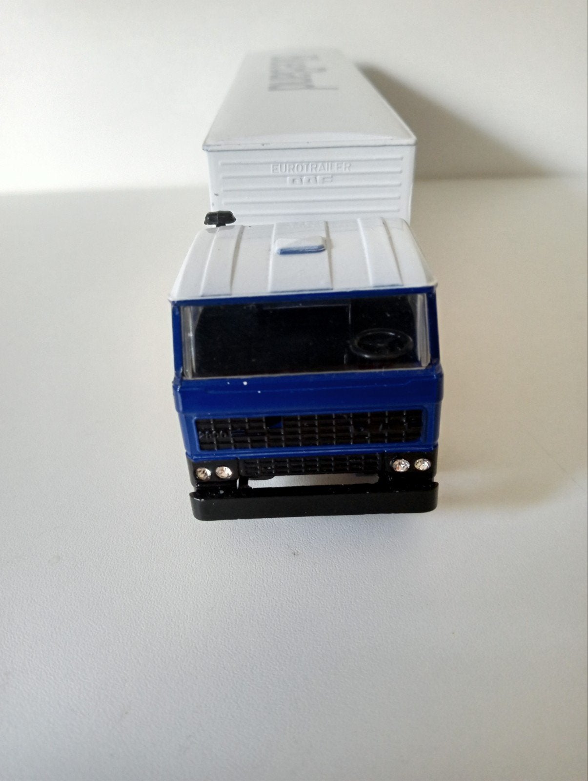 DAF vrachtwagen met Blue Band trailer uit de vitrine., Hobby en Vrije tijd, Ophalen of Verzenden, Zo goed als nieuw, Bus of Vrachtwagen
