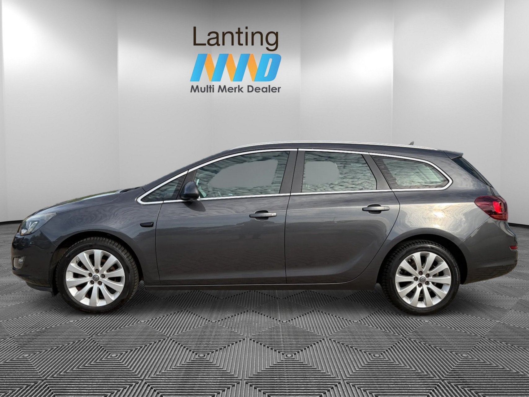Opel Astra Sports Tourer 1.4 Turbo Cosmo airco cruise, Voorwielaandrijving, Euro 5, Gebruikt, 4 cilinders