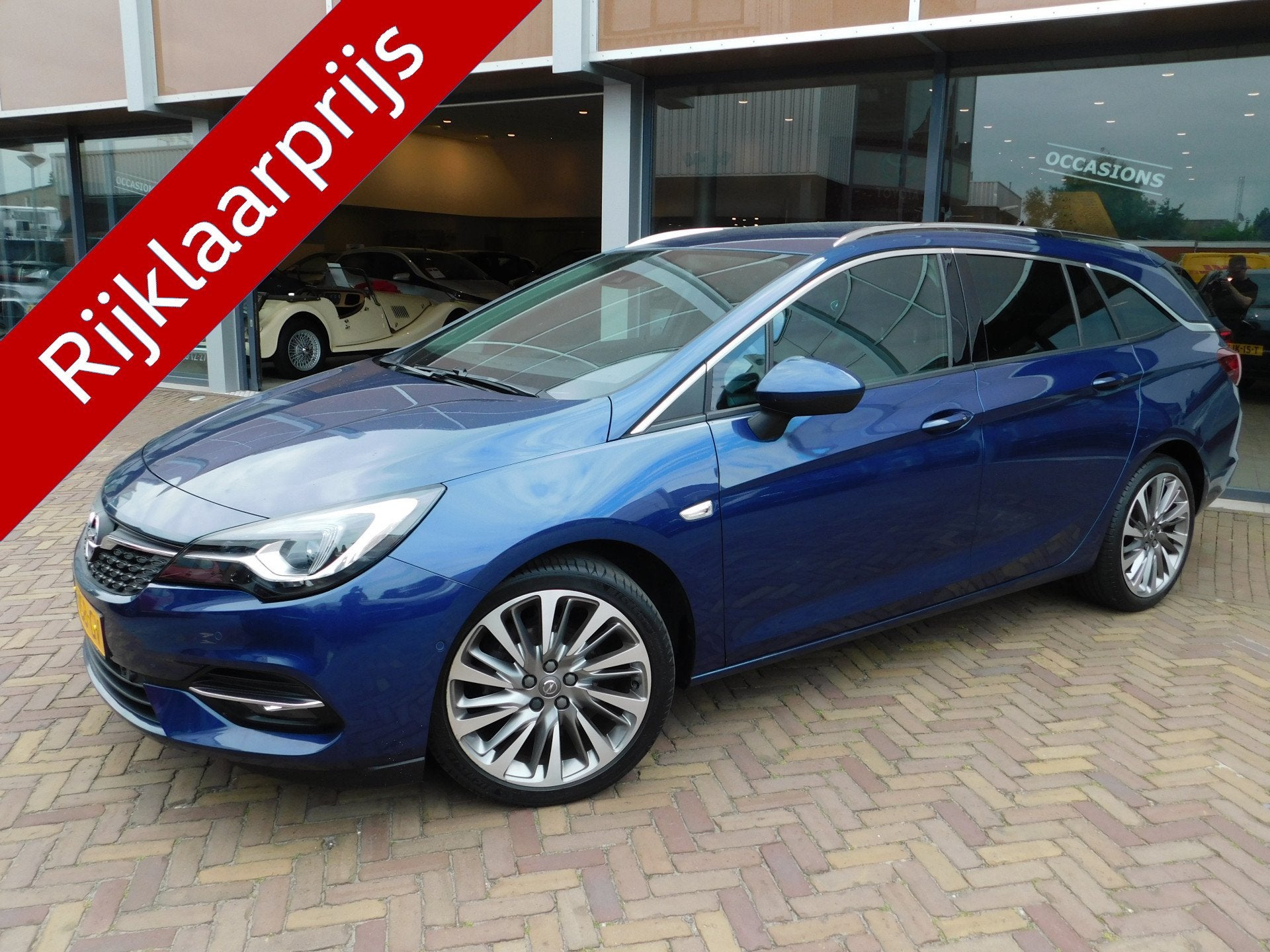 Opel Astra Sports Tourer 1.4 Elegance Automaat (bj 2020), Auto's, Opel, Stof, Gebruikt, Blauw, Origineel Nederlands
