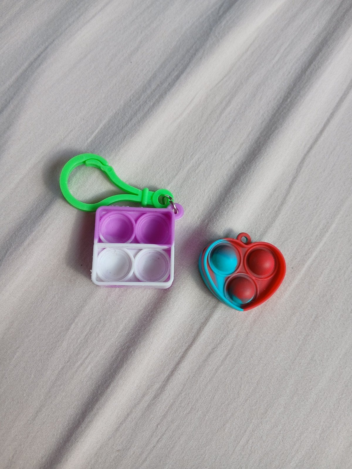 Pop It sleutelhangers - 2 stuks, Kinderen en Baby's, Speelgoed | Overig, Ophalen of Verzenden, Zo goed als nieuw, Meisje