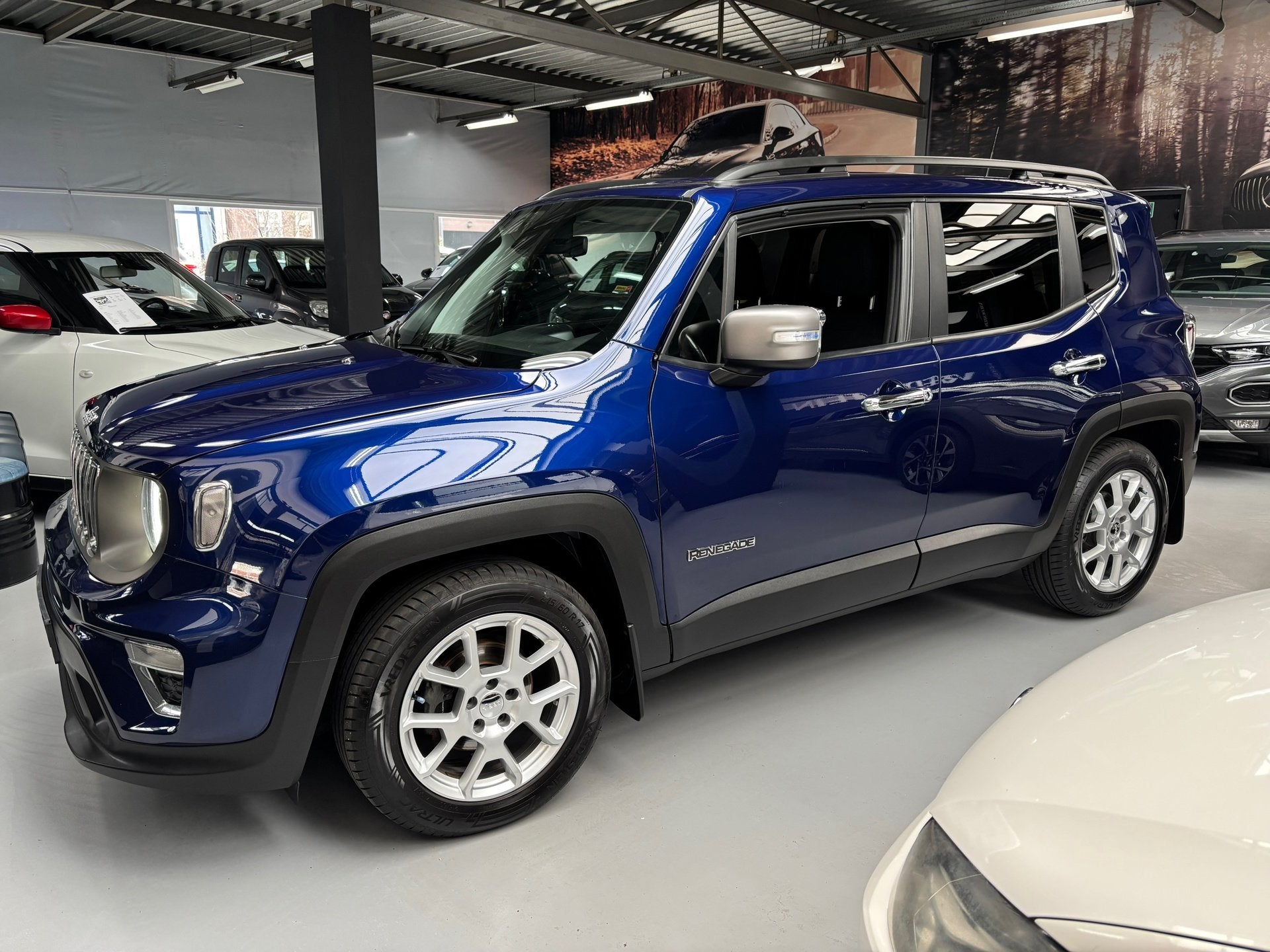 Jeep Renegade 1.0T-e Limited / Navigatie, Auto's, Jeep, Voorwielaandrijving, Stof, Met garantie (alle), Blauw