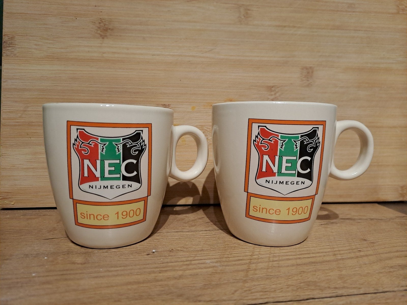 2x NEC Nijmegen Mokken - Sinds 1900, Overige typen, Ophalen of Verzenden, Zo goed als nieuw, Steen/keramiek