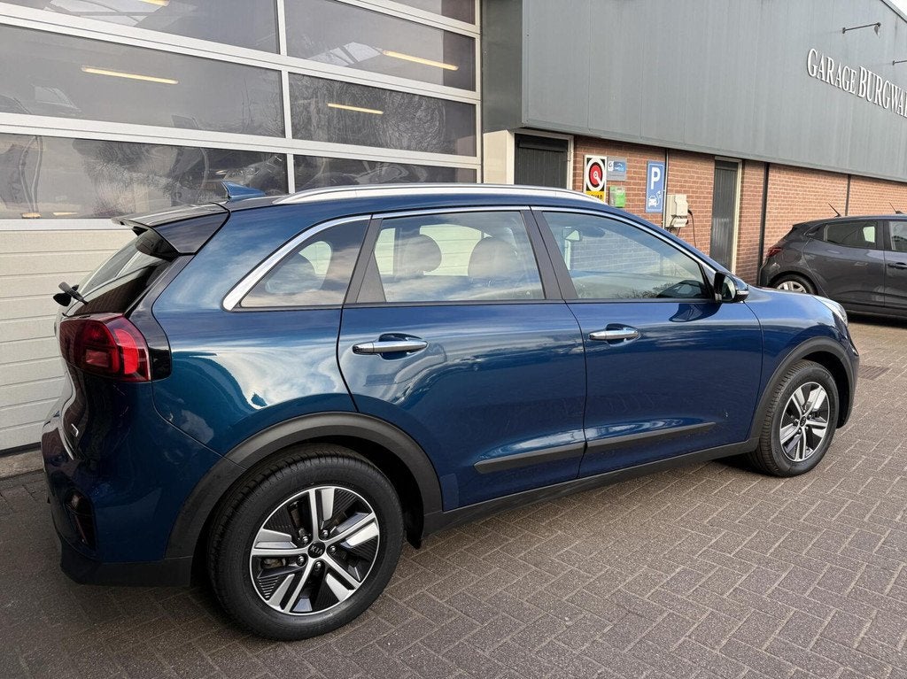 Kia Niro 1.6 GDi Hybrid DynamicLine *ALL-IN PIJS*, Auto's, Kia, 12 maanden, Gebruikt, Blauw, Leder en Stof