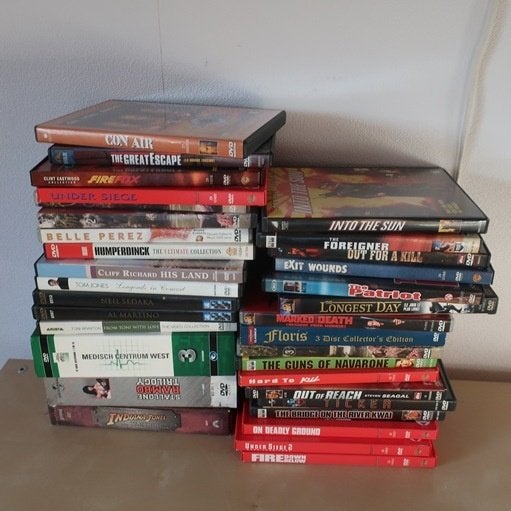 Partij 40 DVD's film muziek serie o.a. Rambo & Indiana Jones, Vanaf 16 jaar, Ophalen, Gebruikt, Actie