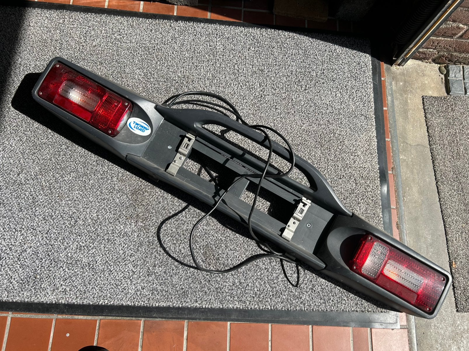 Achterbord voor fietsenrek, Ophalen