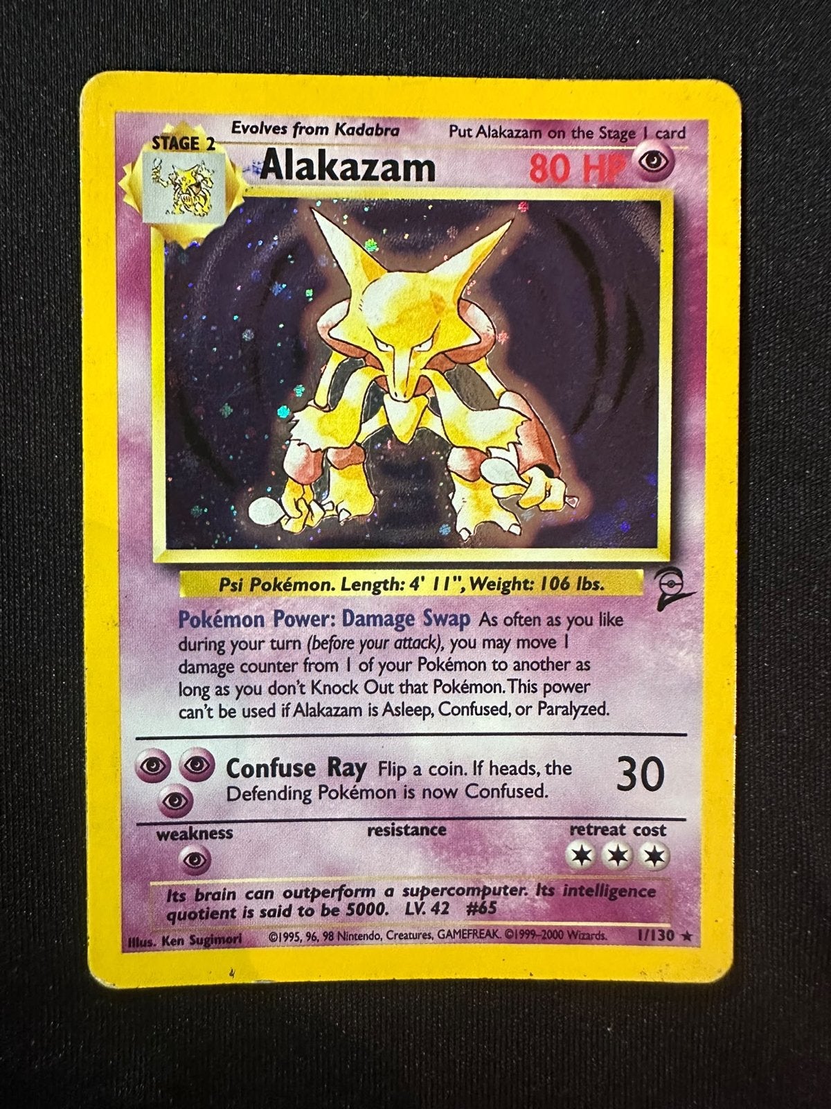 Alakazam Pokémon Kaart 1/130 Base Set 2 Holo, Ophalen of Verzenden, Gebruikt, Losse kaart, Foil