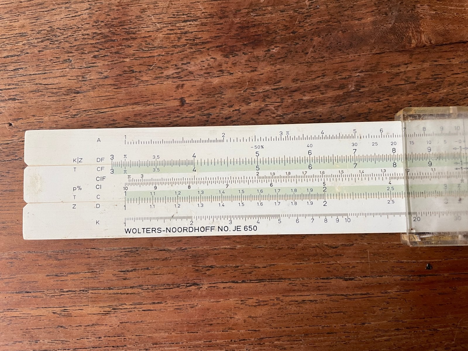 Vintage Rekenliniaal Wolters-Noordhoff JE 650 met hoes, Ophalen of Verzenden