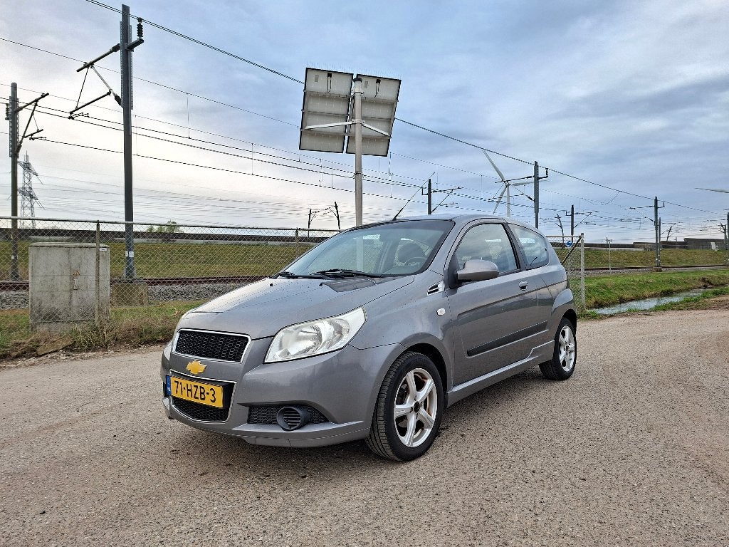 Chevrolet Aveo 1.2 16V 3D 2009 Grijs Airco NIEUWE APK, Auto's, Chevrolet, Bedrijf, Aveo, ABS, Airbags, Airconditioning, Alarm