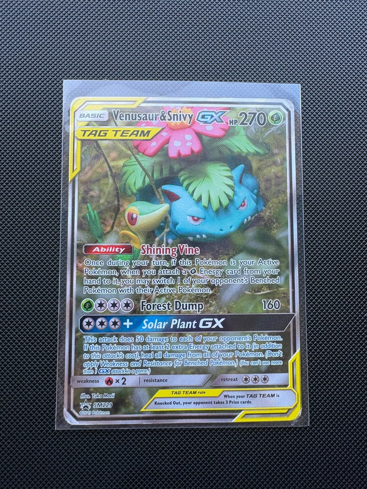 Venusaur & Snivy GX SM229 Black Star Promo, Ophalen of Verzenden, Gebruikt, Losse kaart