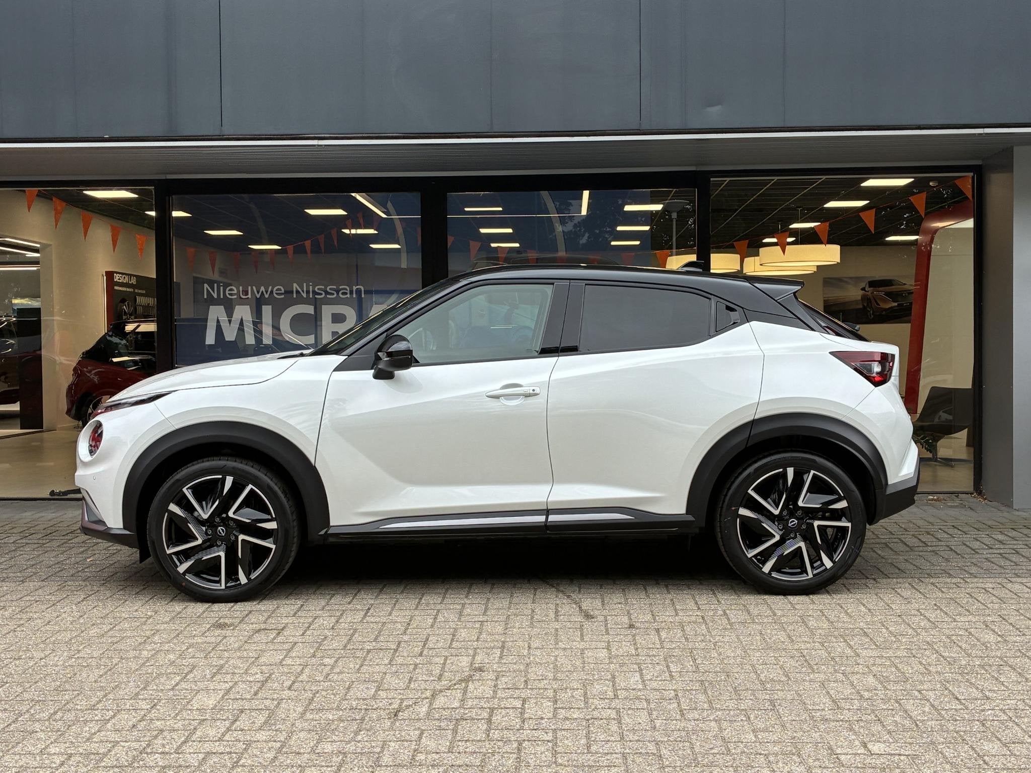 Nissan Juke 1.0 DIG-T N-Design NIEUW UIT VOORRAAD LEVERBAAR, Auto's, Stof, Met garantie (alle), Wit, Bedrijf