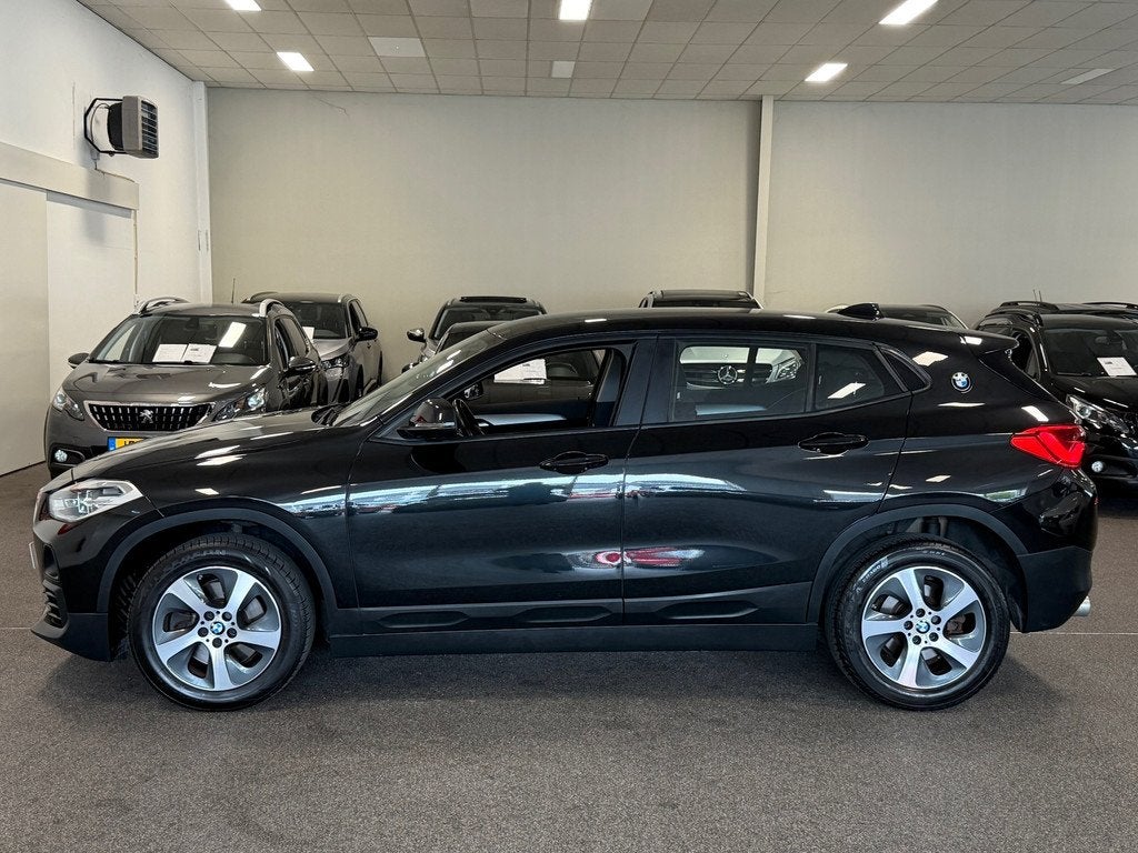 BMW X2 SDrive20i High Executive|NAVIGATIE|CRUISE|ECC AIRCO, Auto's, 1998 cc, Euro 6, 1435 kg, Zwart