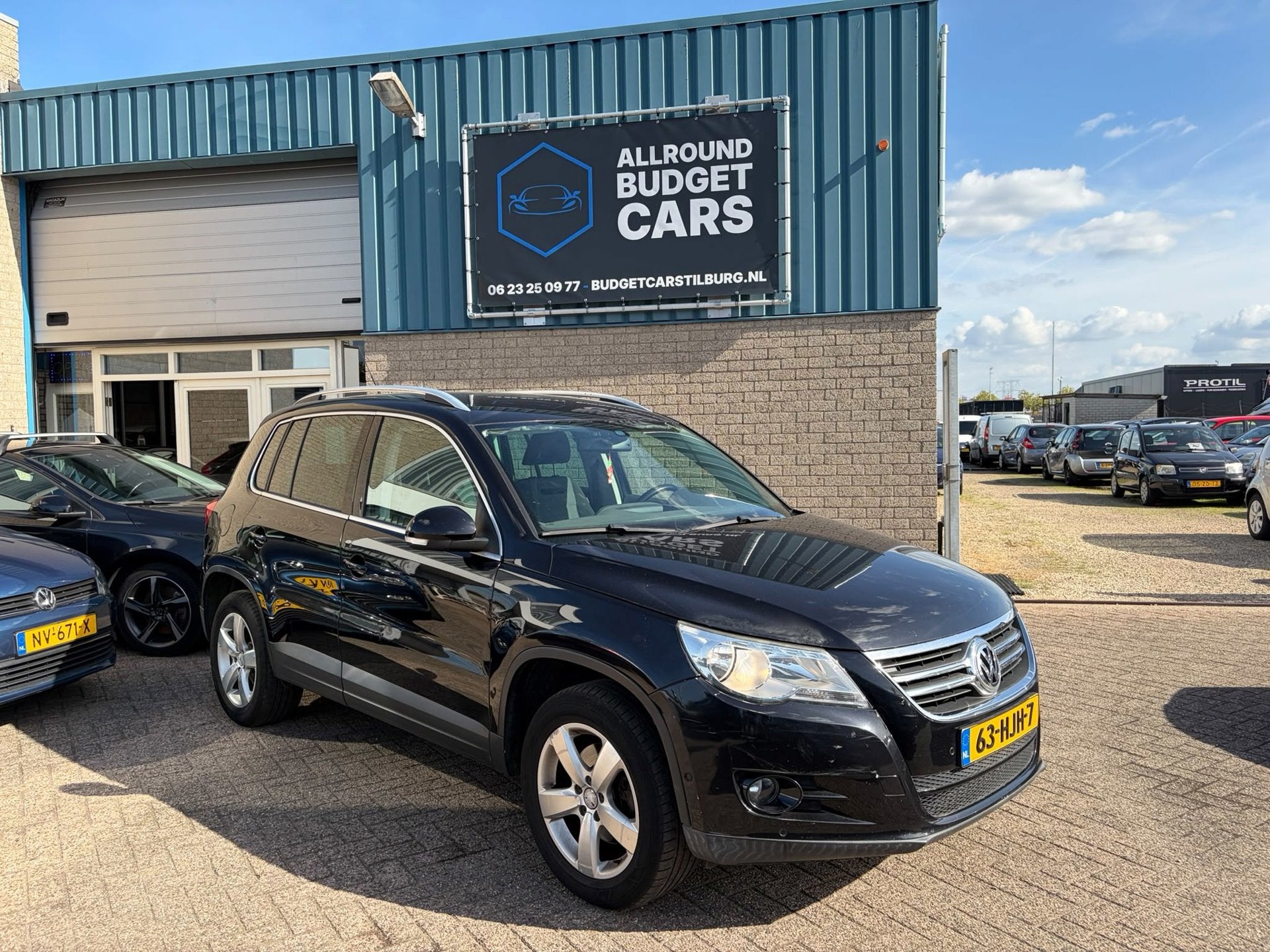 Volkswagen Tiguan 1.4 TSI Sport&Style, Auto's, Voorwielaandrijving, Euro 5, Stof, Zwart