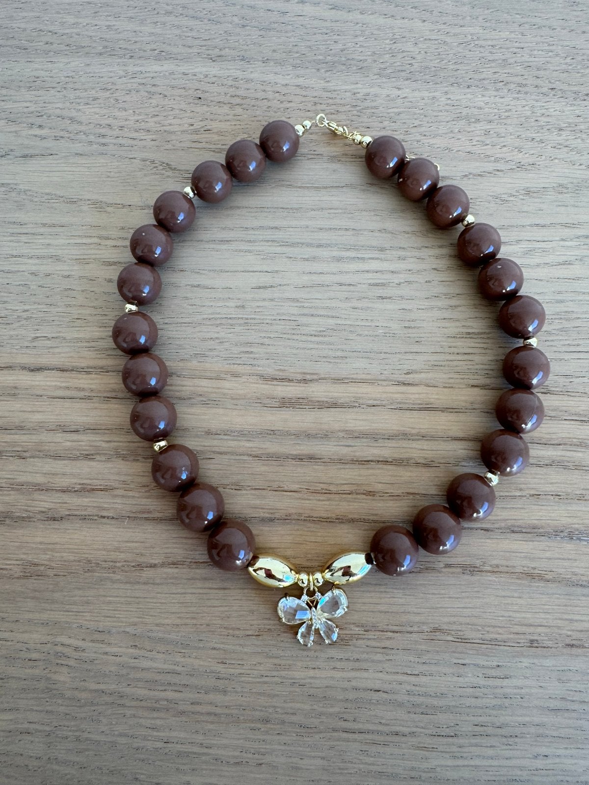 Bruine kralenketting met vlinderhanger, Met kristal, Overige materialen, Bruin, Nieuw