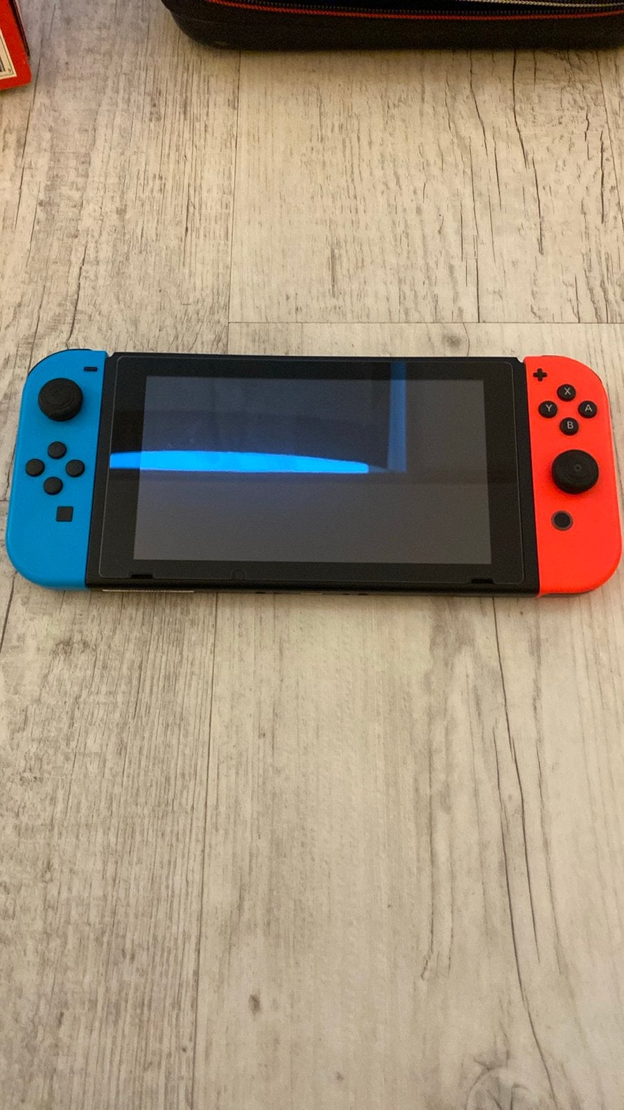 Nintendo Switch V1 rood/blauw - complete set + Super Mario O, Spelcomputers en Games, Met 2 controllers, Ophalen of Verzenden