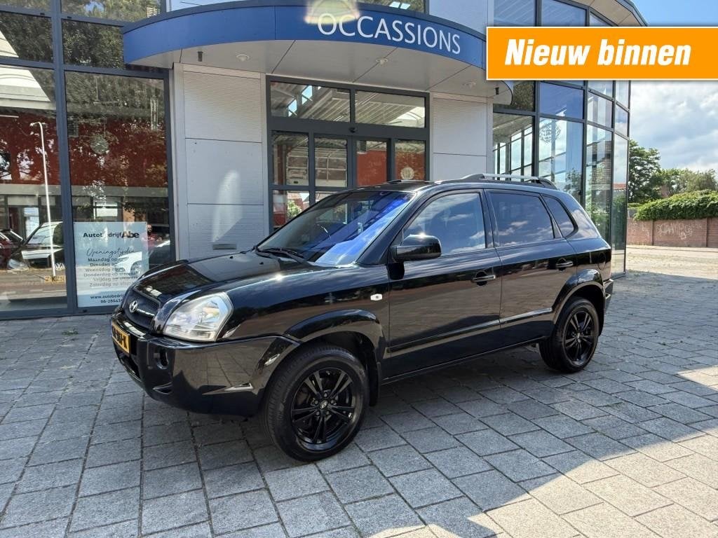 Hyundai TUCSON 2.0I STYLE PREMIUM-LMV-ECC-PDC-LEER-MOOIE AUT, Auto's, Hyundai, Gebruikt, 142 pk, 4 cilinders, Zwart