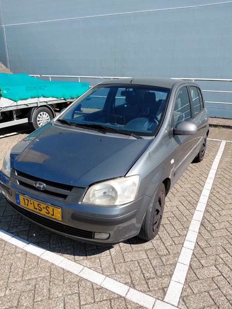 Hyundai Getz 1.3 5DRS 2003 Grijs, Auto's, Voorwielaandrijving, 40 €/maand, 4 cilinders, Origineel Nederlands