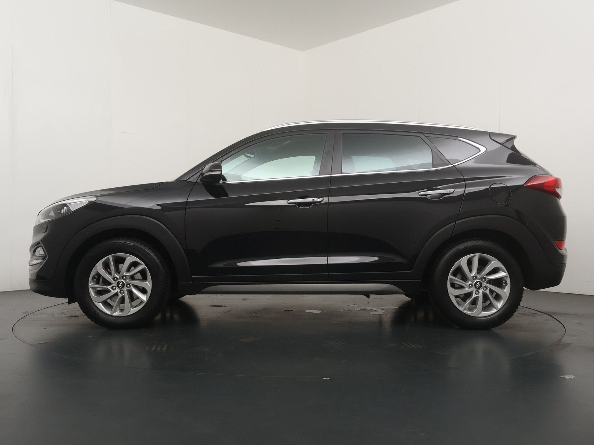 Hyundai Tucson 1.6 T-GDi Premium - Navigatie - Achteruitrijc, Auto's, Voorwielaandrijving, Gebruikt, 4 cilinders, Zwart