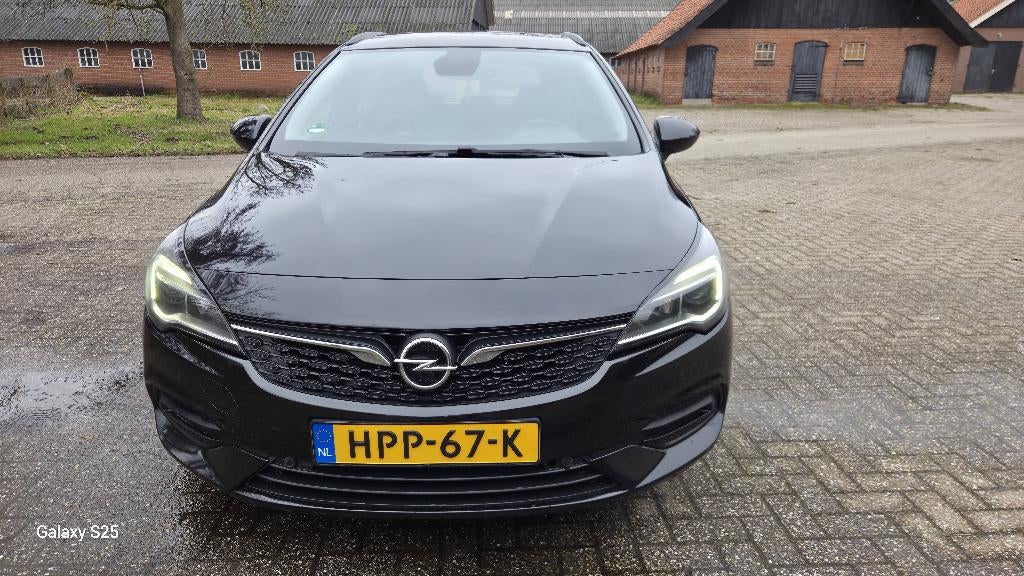 Opel Astra 1.4 Turbo 145pk Start/stop Aut 2020 Zwart, Auto's, Opel, 145 pk, 1295 kg, Zwart, Stationwagon