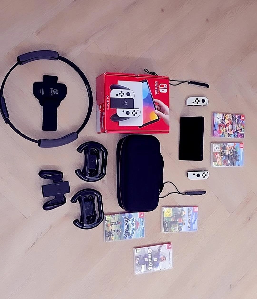 Nintendo Switch OLED met Ring Fit Adventure en games, Spelcomputers en Games, Spelcomputers | Nintendo Switch, Zo goed als nieuw
