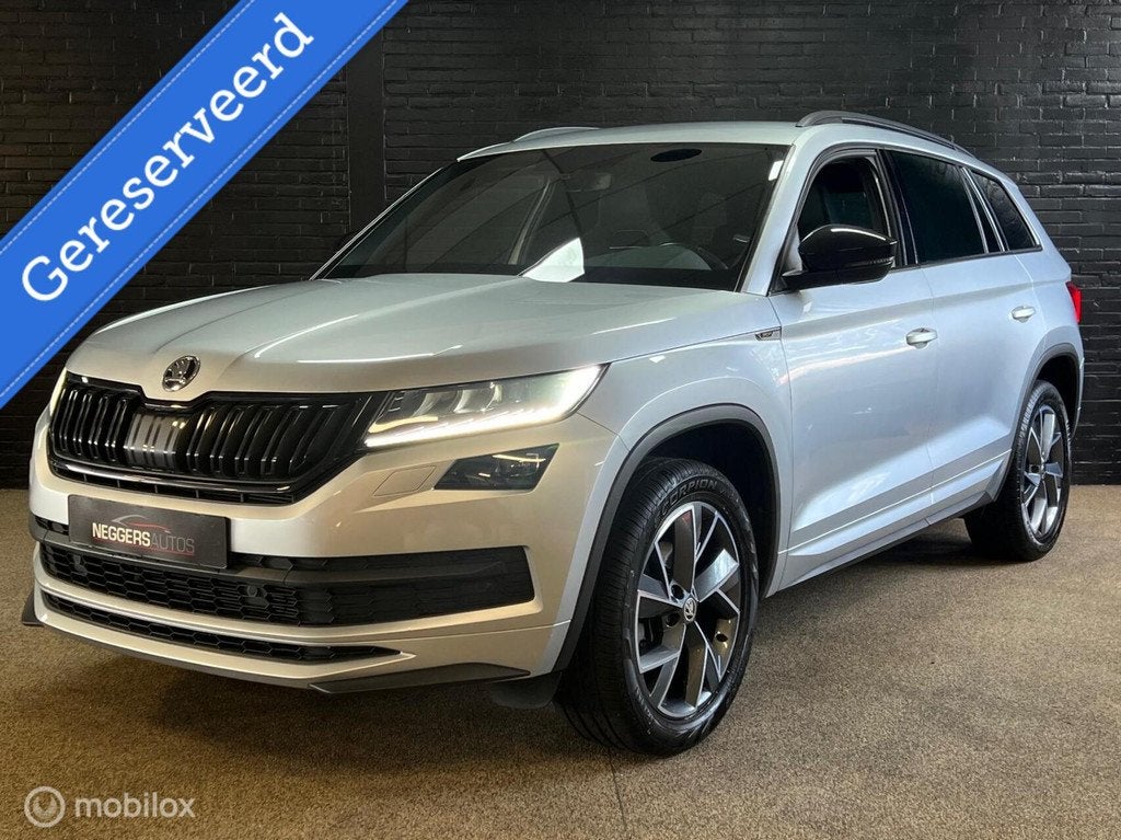 Skoda Kodiaq 1.5 TSI Sportline Business 1e EIG LED ADAP DSG, Auto's, Skoda, Zwart, 4 cilinders, 150 pk, Automatische klimaatregeling