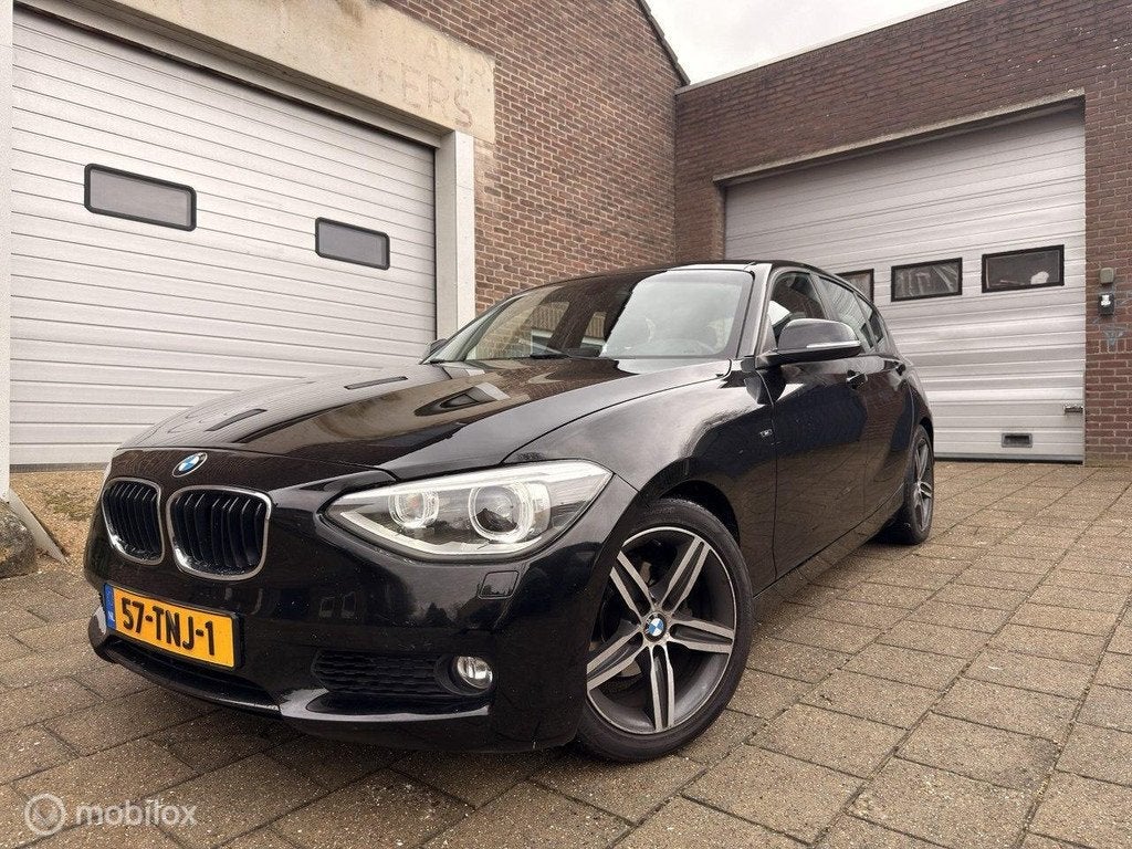 BMW 1-serie 116i Business, Auto's, BMW, 1-Serie, Euro 5, 4 cilinders, Zwart