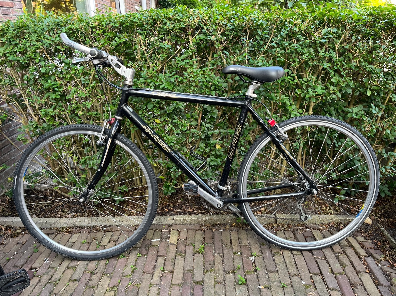 Zwarte sportieve Jan Janssen fiets met 21 versnellingen, 28 inch, Gebruikt, Velgrem, 49 tot 53 cm