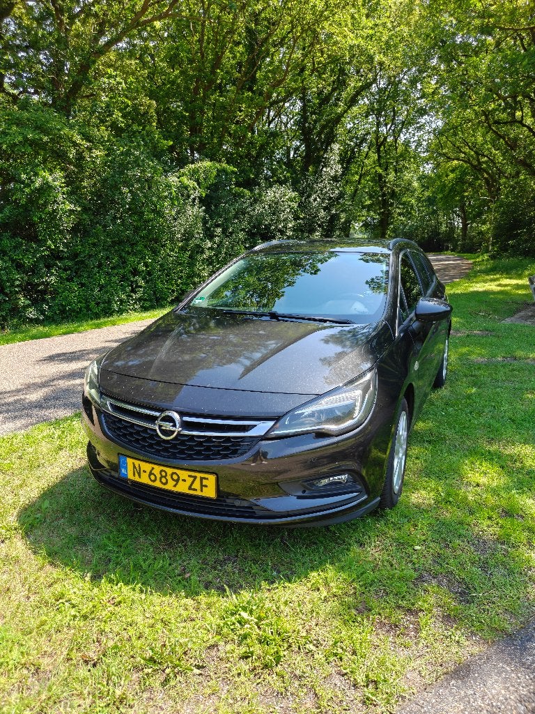 Opel Astra Sports Tourer 1.4 Turbo Automaat 150pk, Auto's, Opel, Stof, 4 cilinders, Zwart, Stationwagon