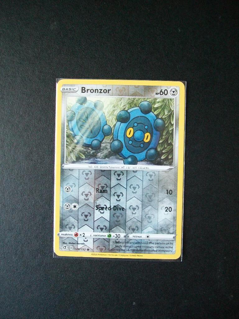 9101. Nieuwe Pokemon Kaart holofoil BRONZOR hp 60 (129/192), Verzenden, Nieuw, Losse kaart, Foil