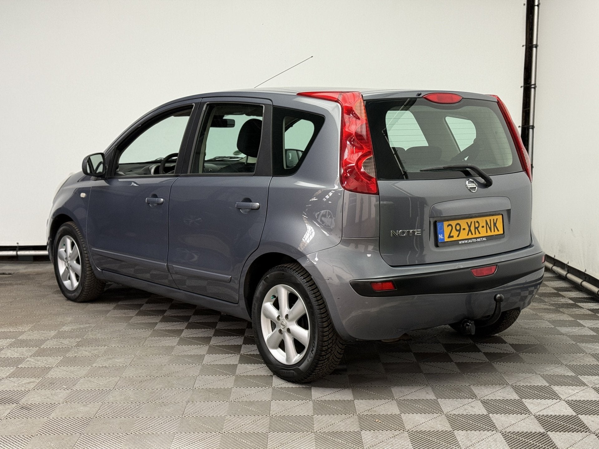Nissan Note 1.4 Acenta ECC Trekhaak NL Auto (bj 2007), Auto's, Nissan, Voorwielaandrijving, Stof, 4 cilinders, Met garantie (alle)