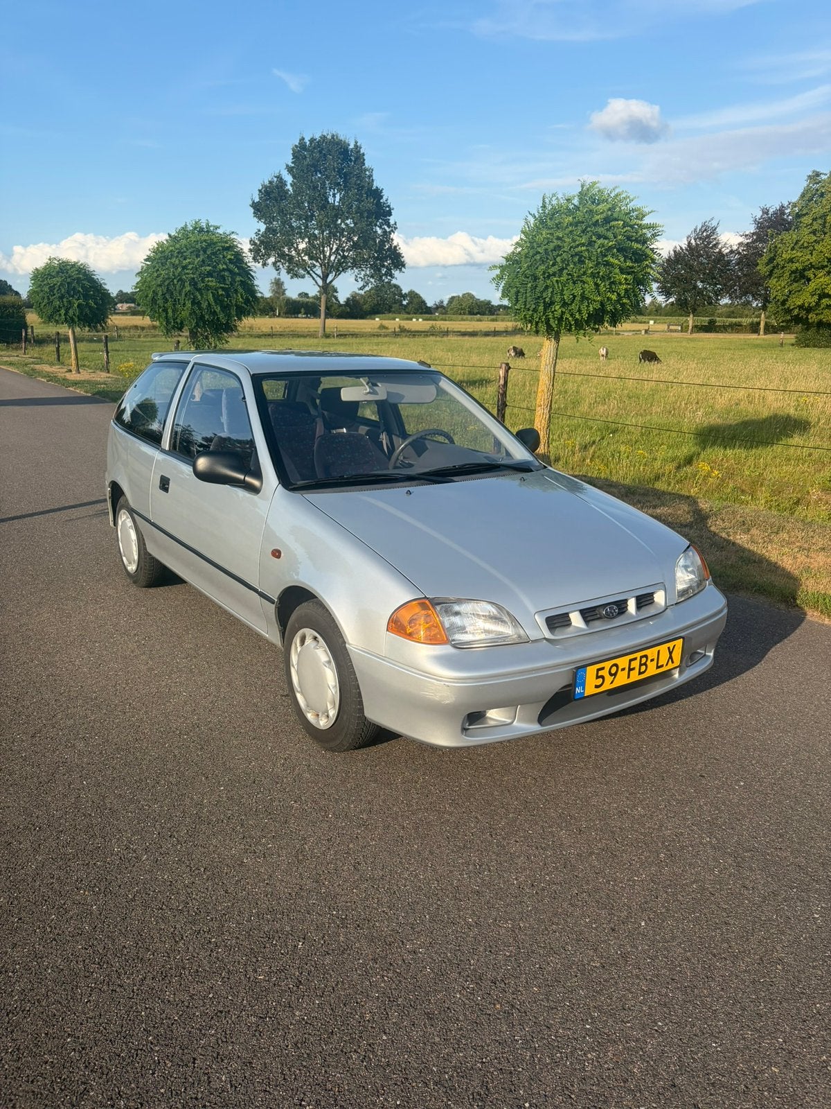 Subaru Justy 1.3 GX AWD 2000 Grijs, Auto's, Justy, Stof, Beige, 4 cilinders
