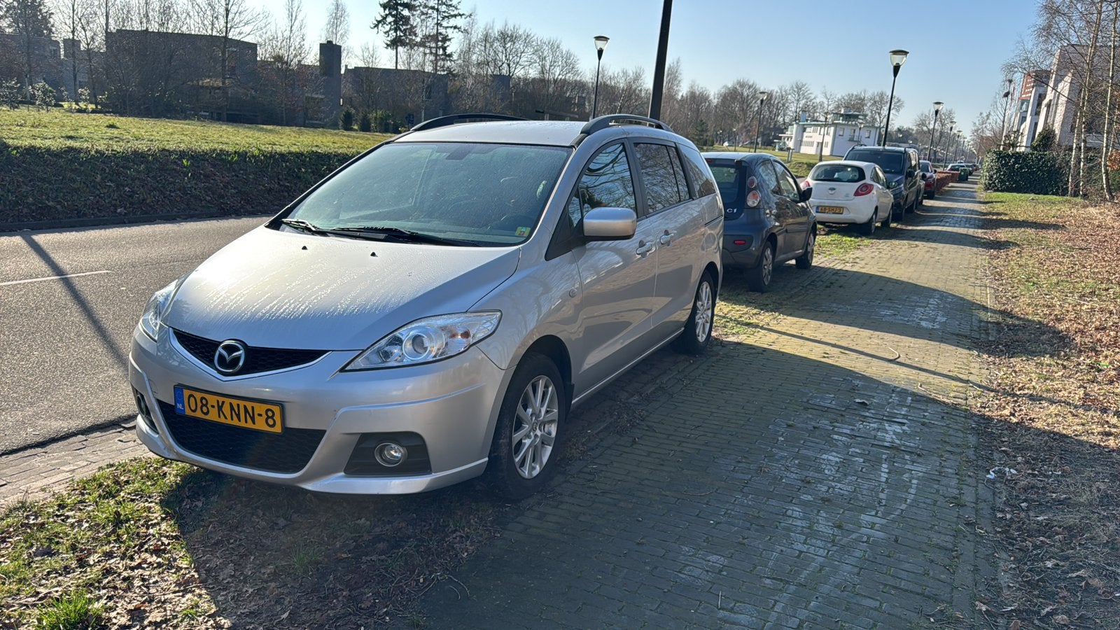 Mazda 5 1.8 2010 Grijs 7zitter gezinsauto met Nieuwe APK, Auto's, Zwart, 4 cilinders, 7 stoelen, Origineel Nederlands