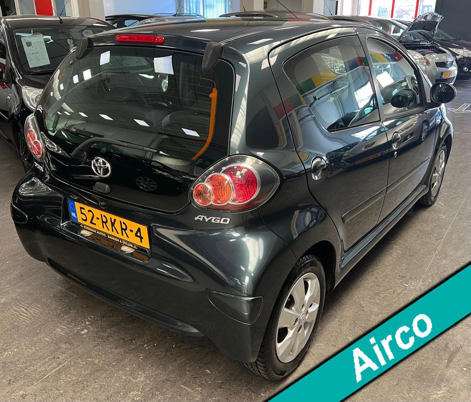 Toyota Aygo 1.0-12V Aspiration Navigator 2e Eigenaar - NAP -, Auto's, Voorwielaandrijving, Gebruikt, 4 stoelen, Alcantara