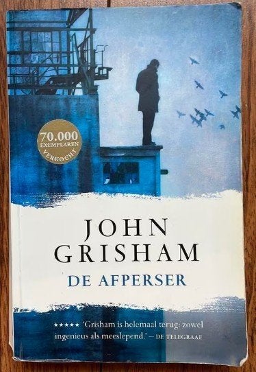 John Grisham - De afperser, Ophalen of Verzenden, Zo goed als nieuw