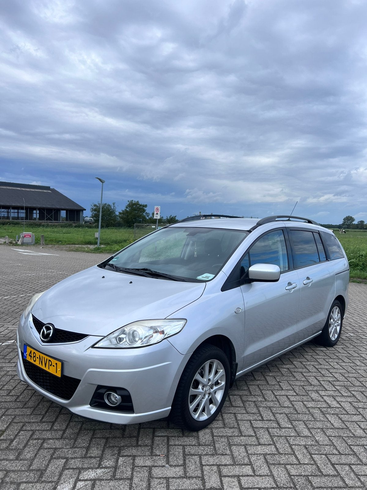Mazda 5 1.8 2010 Grijs, Auto's, 4 cilinders, 7 stoelen, Origineel Nederlands, Handgeschakeld