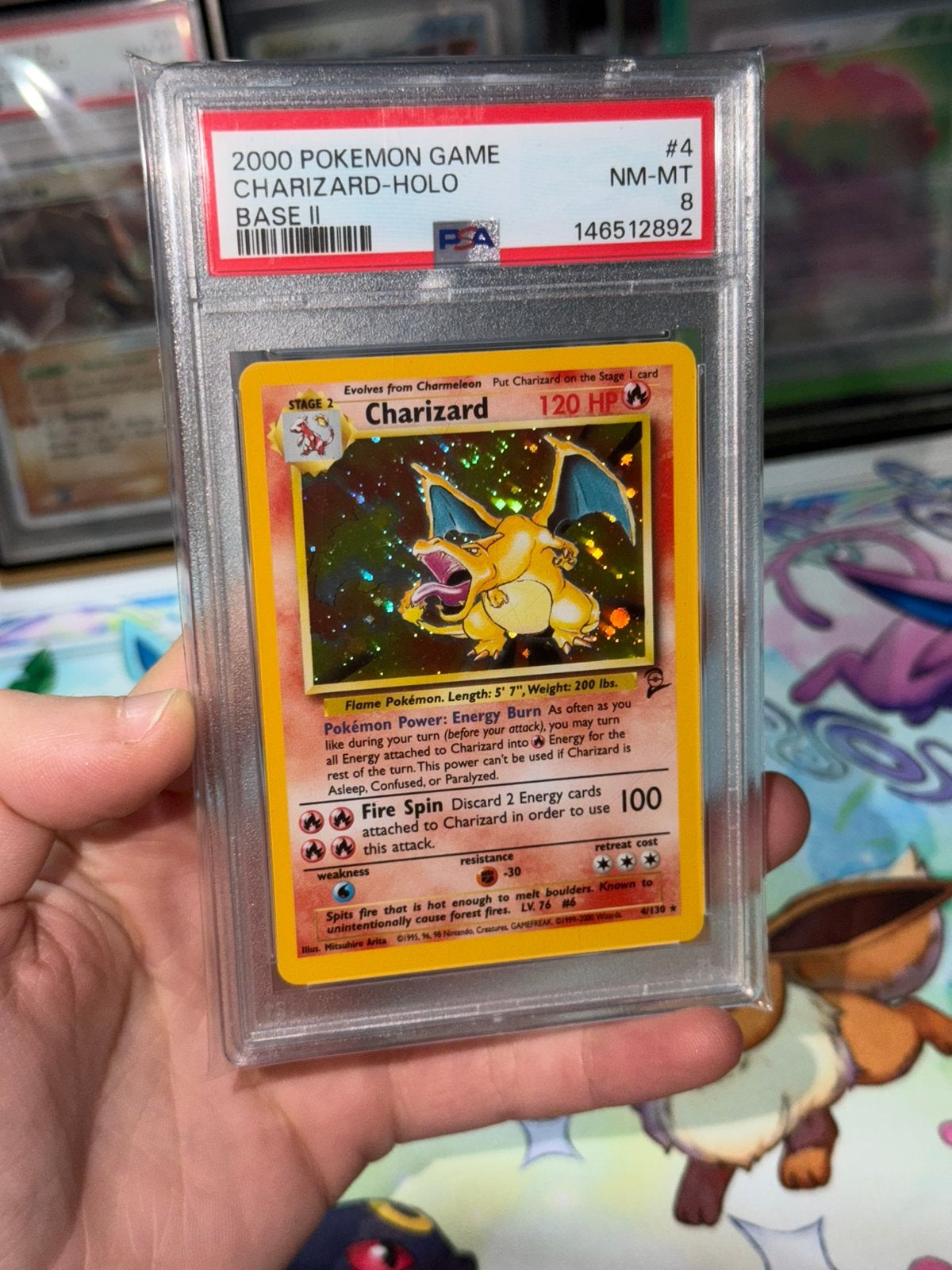 Charizard #4/130 Base Set 2 PSA 8 NM-Mint + Swirl 🌀, Ophalen, Zo goed als nieuw
