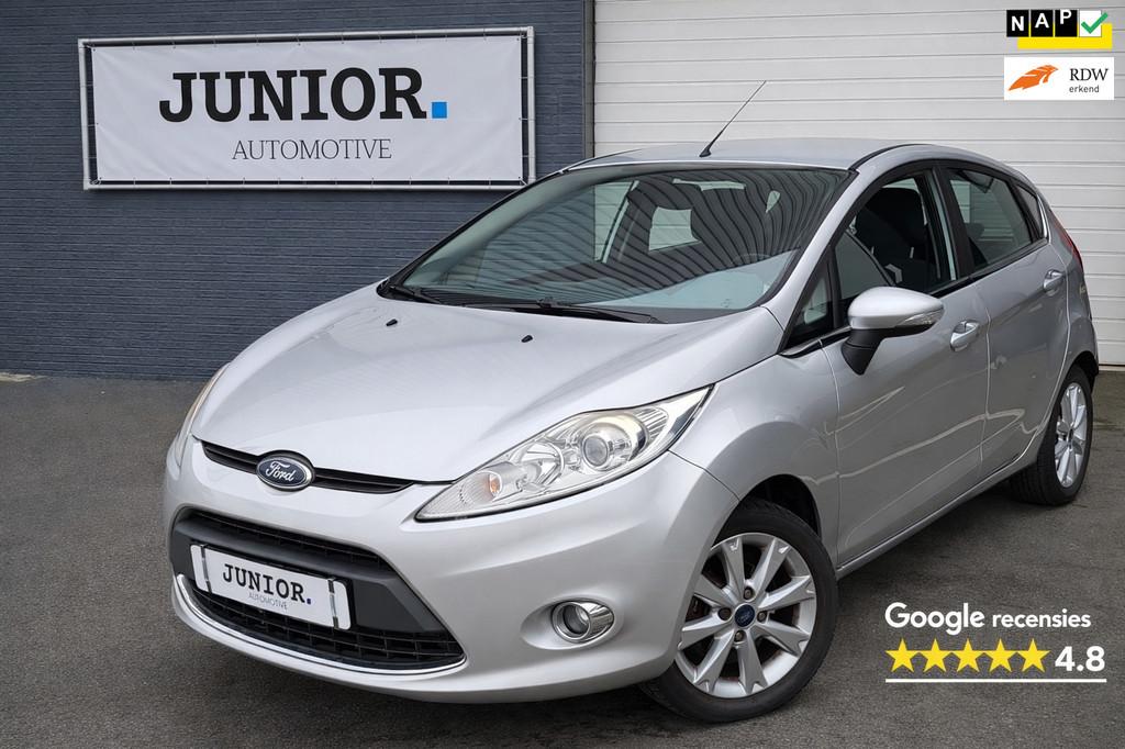 Ford Fiesta 1.25 Ghia CRUISE/CLIMA/LAGEKM/XENON/LMV/PDC, Auto's, Ford, Voorwielaandrijving, Stof, 82 pk, Origineel Nederlands