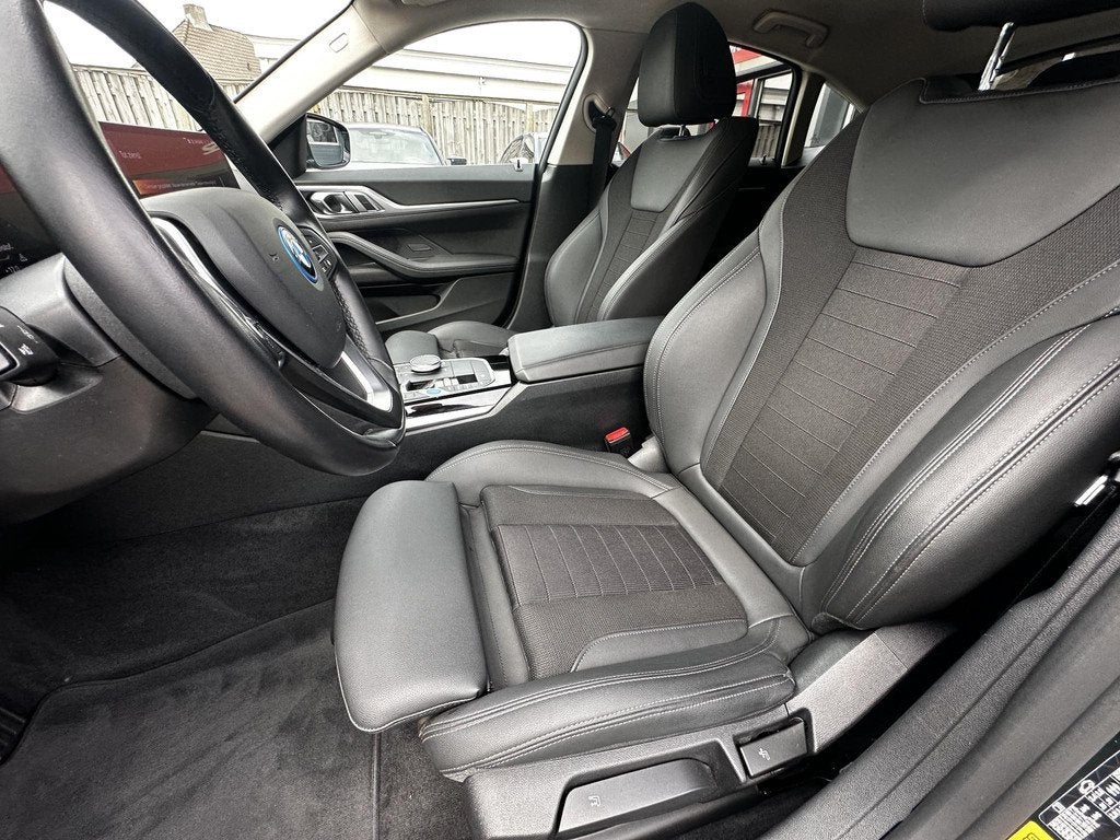 BMW i4 eDrive35 70 kWh, Auto's, BMW, Achterwielaandrijving, Gebruikt, Zwart, Leder en Stof