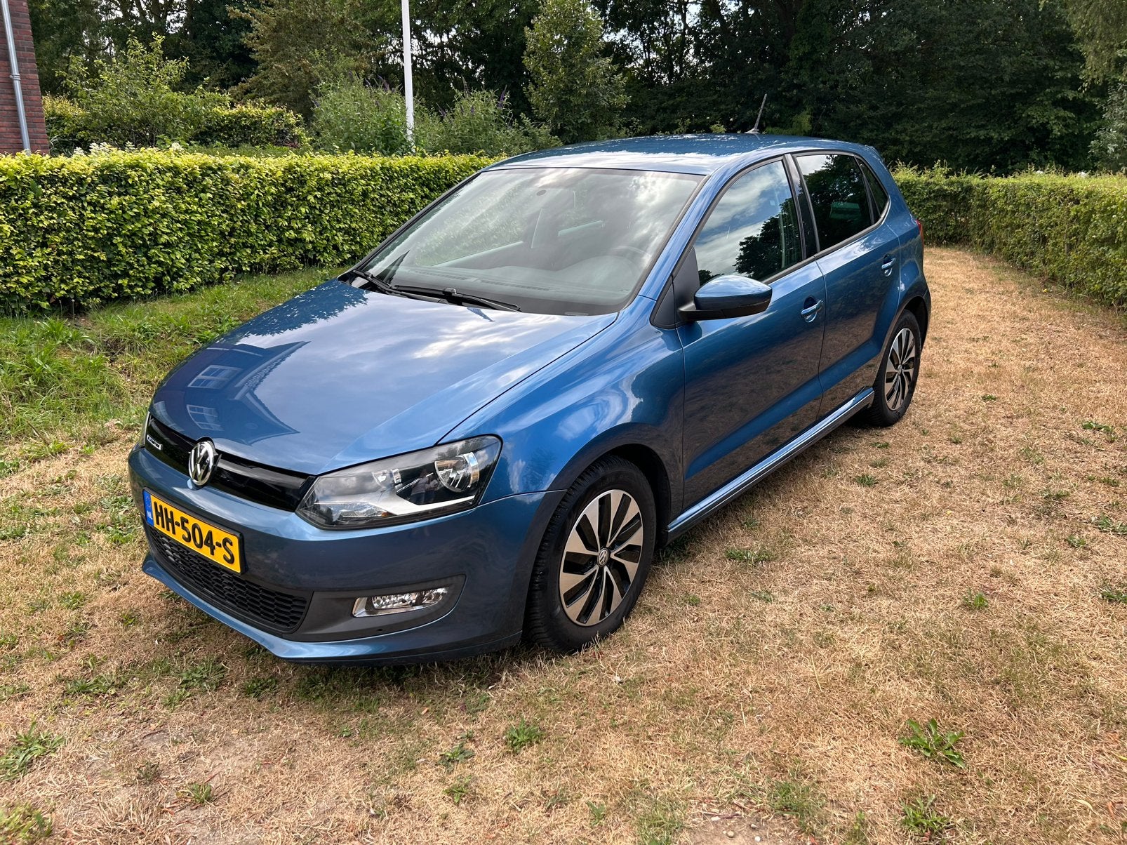 Volkswagen Polo 1.0 TSI Bluemotion (70 KW) - 2015, Auto's, Voorwielaandrijving, Stof, Zwart, Blauw