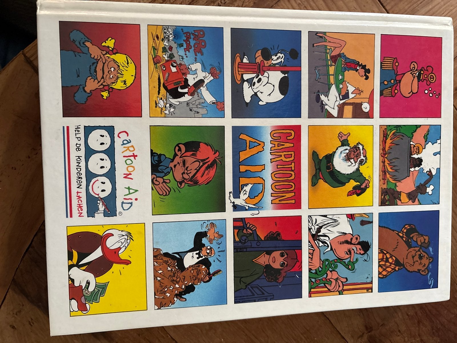 Cartoon Aid: Help de Kinderen Lachen - Stripboek, Eén stripboek, Ophalen of Verzenden, Zo goed als nieuw
