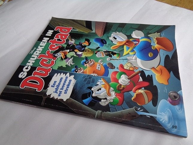 Donald Duck, Schurken in Duckstad (Jubileum Uitgave) Album., Gelezen, Eén stripboek, Ophalen of Verzenden, Donald Duck