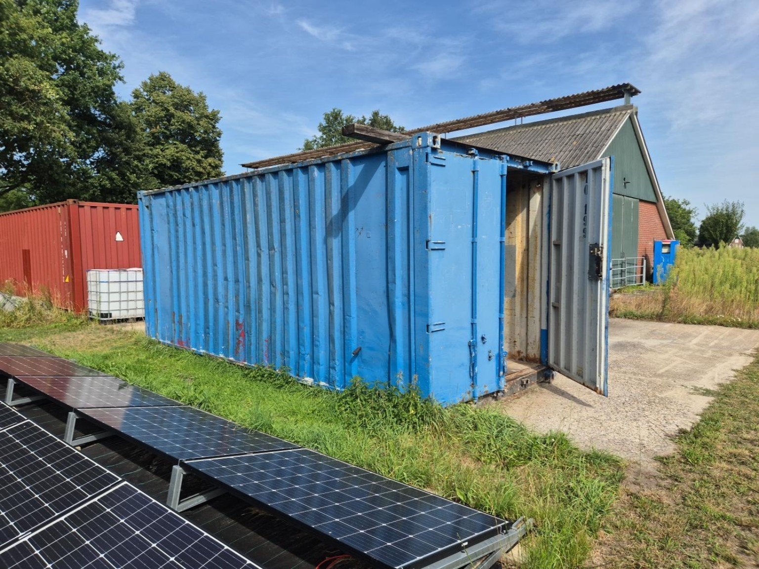 20ft container met houten stelling en kast, Ophalen