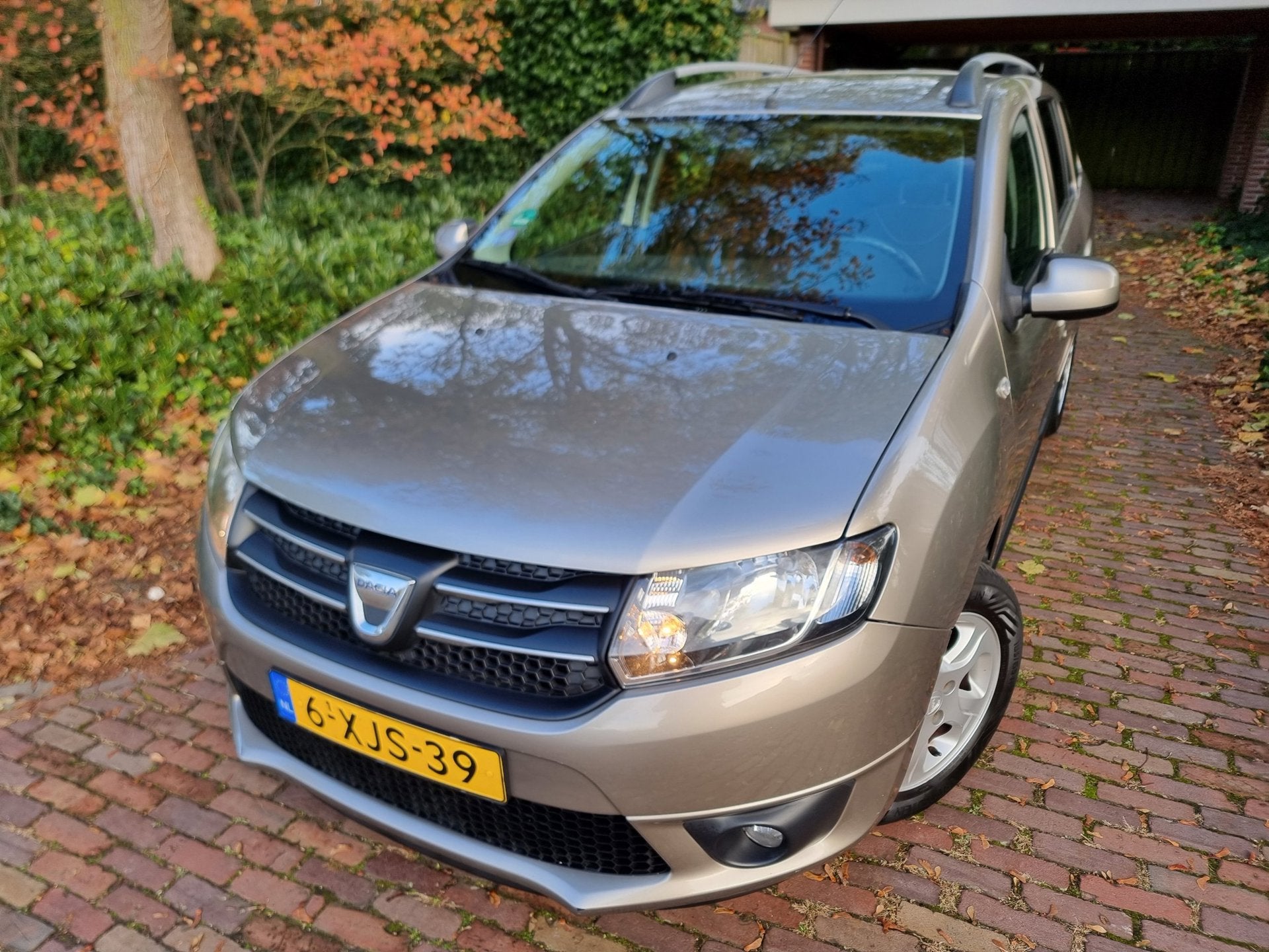 Dacia Logan MCV 0.9 TCe Prestige EXPORT, Auto's, Voorwielaandrijving, Bruin, Origineel Nederlands, Bedrijf