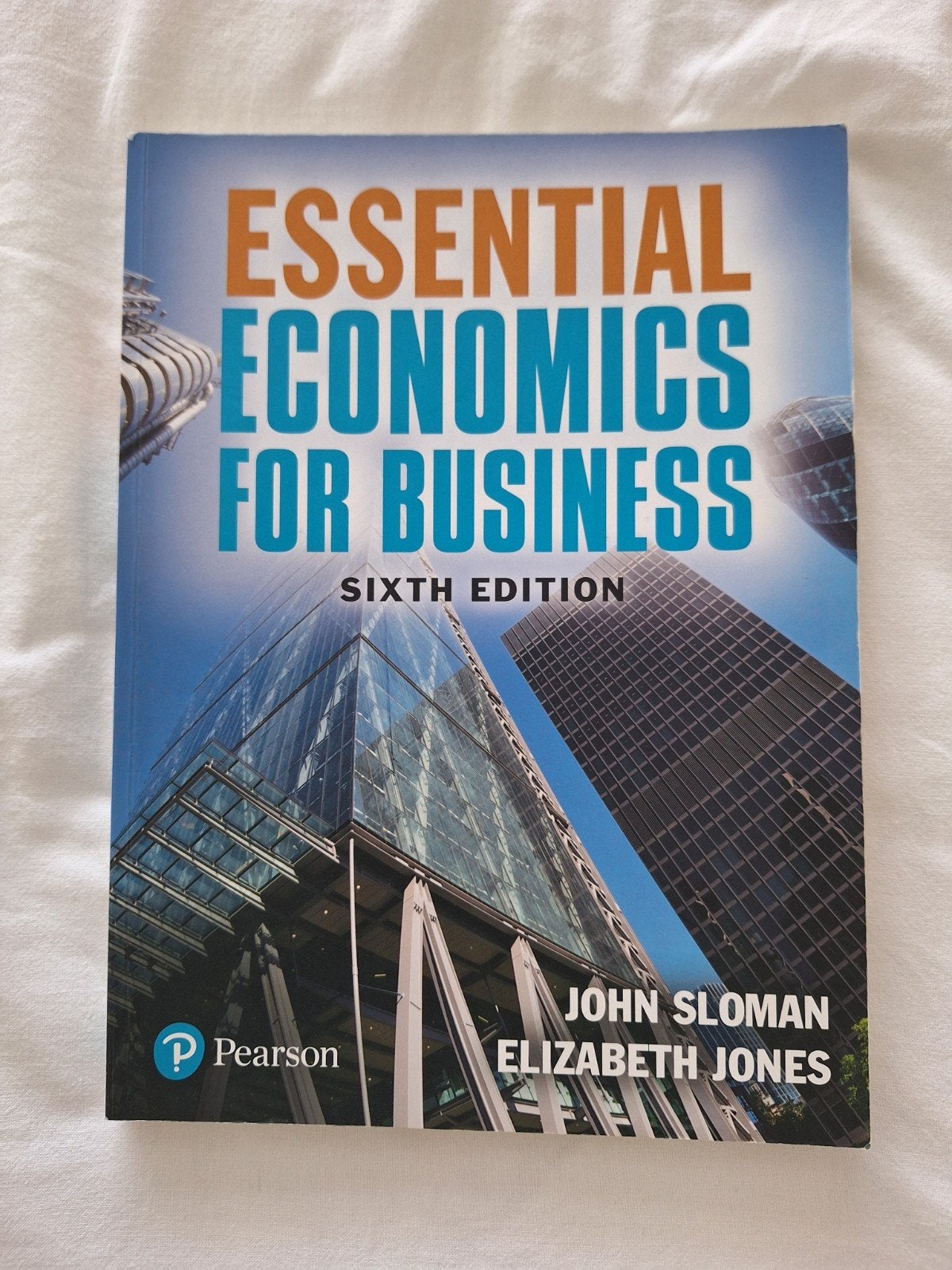 Essential Economics for Business - Sloman & Jones, Ophalen of Verzenden, Zo goed als nieuw