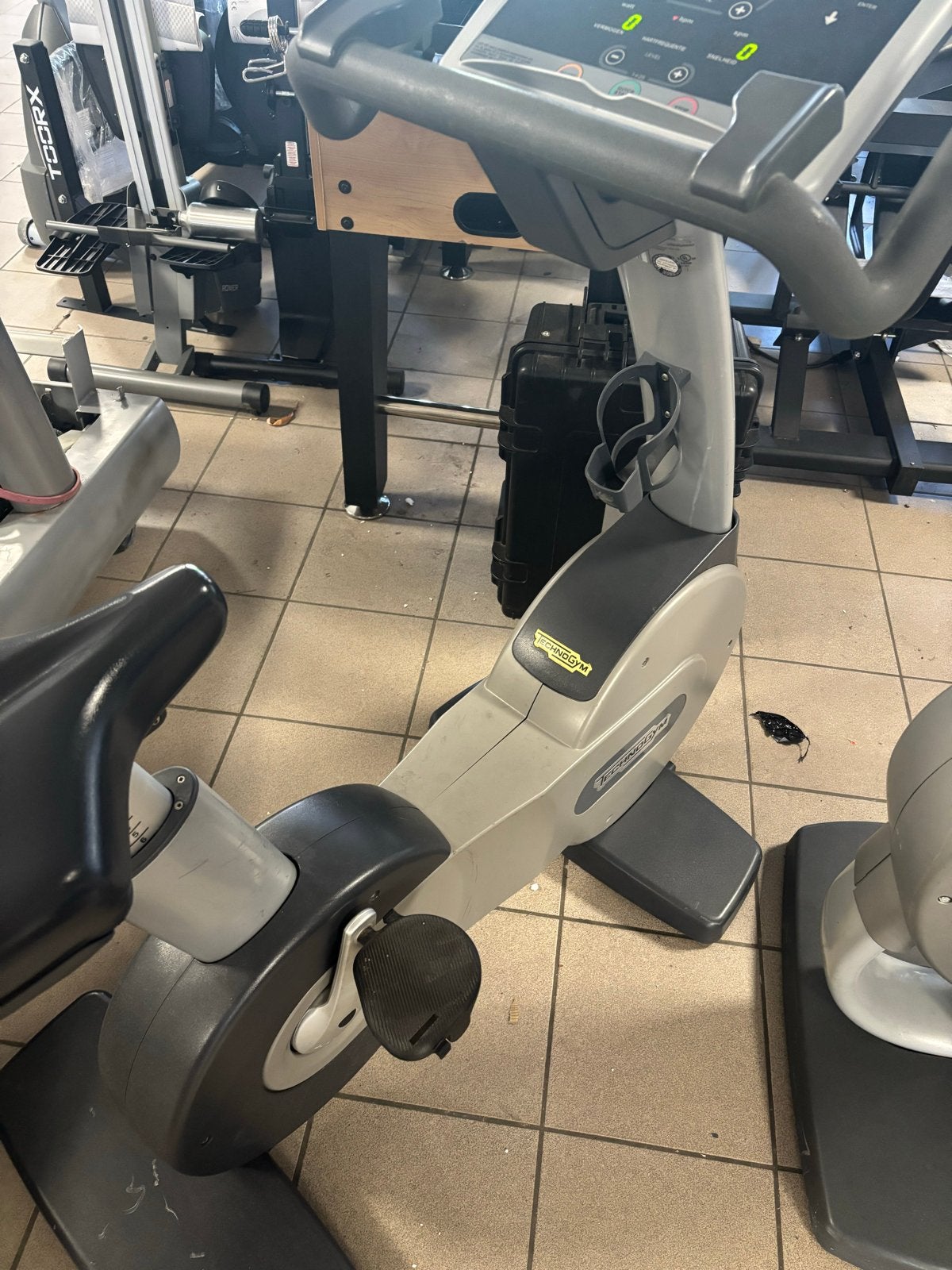 Technogym 500 Hometrainer - Professionele Fitnessfiets, Kunststof, Gebruikt, Ophalen of Verzenden, Benen