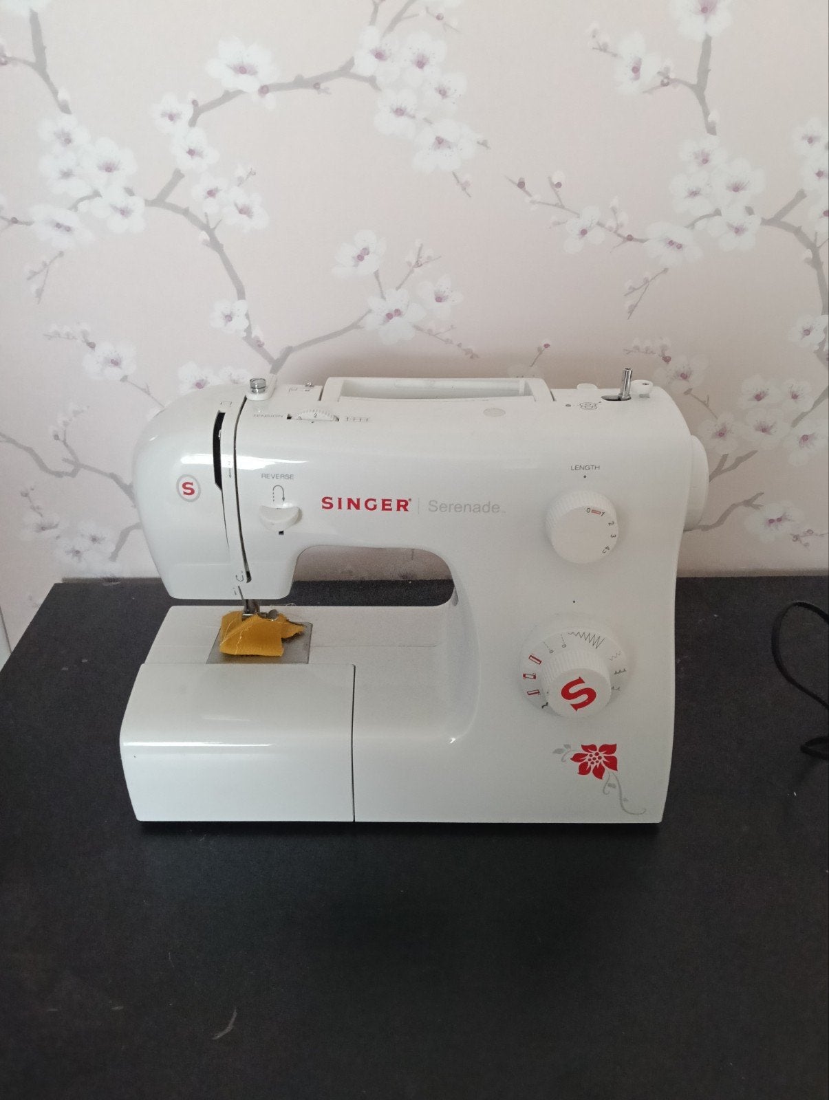 naaimachine met stof, Ophalen
