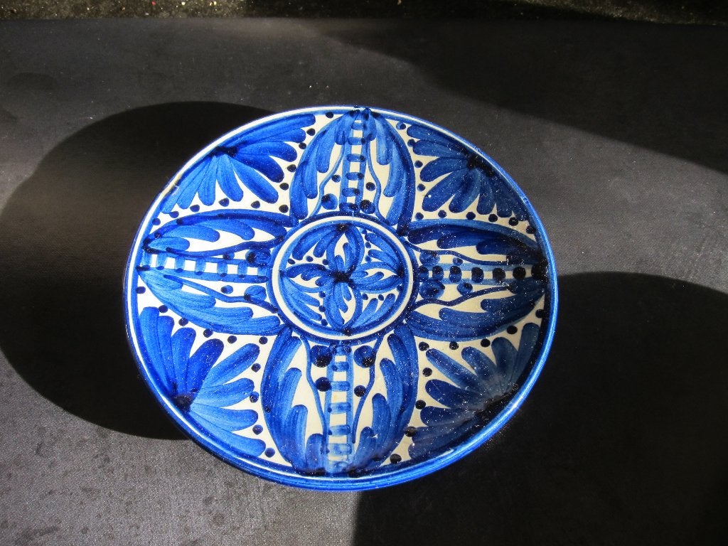 Blauw handbeschilderd wandbord, Ophalen