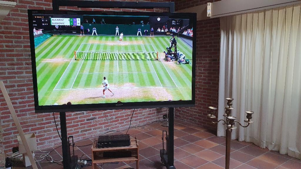 TV meubel 2-zijdig verrijdbaar  zwart 120 breed, Ophalen, 100 tot 150 cm, Mat zwart.  Metaal . Diepte betreft voet, 100 tot 150 cm