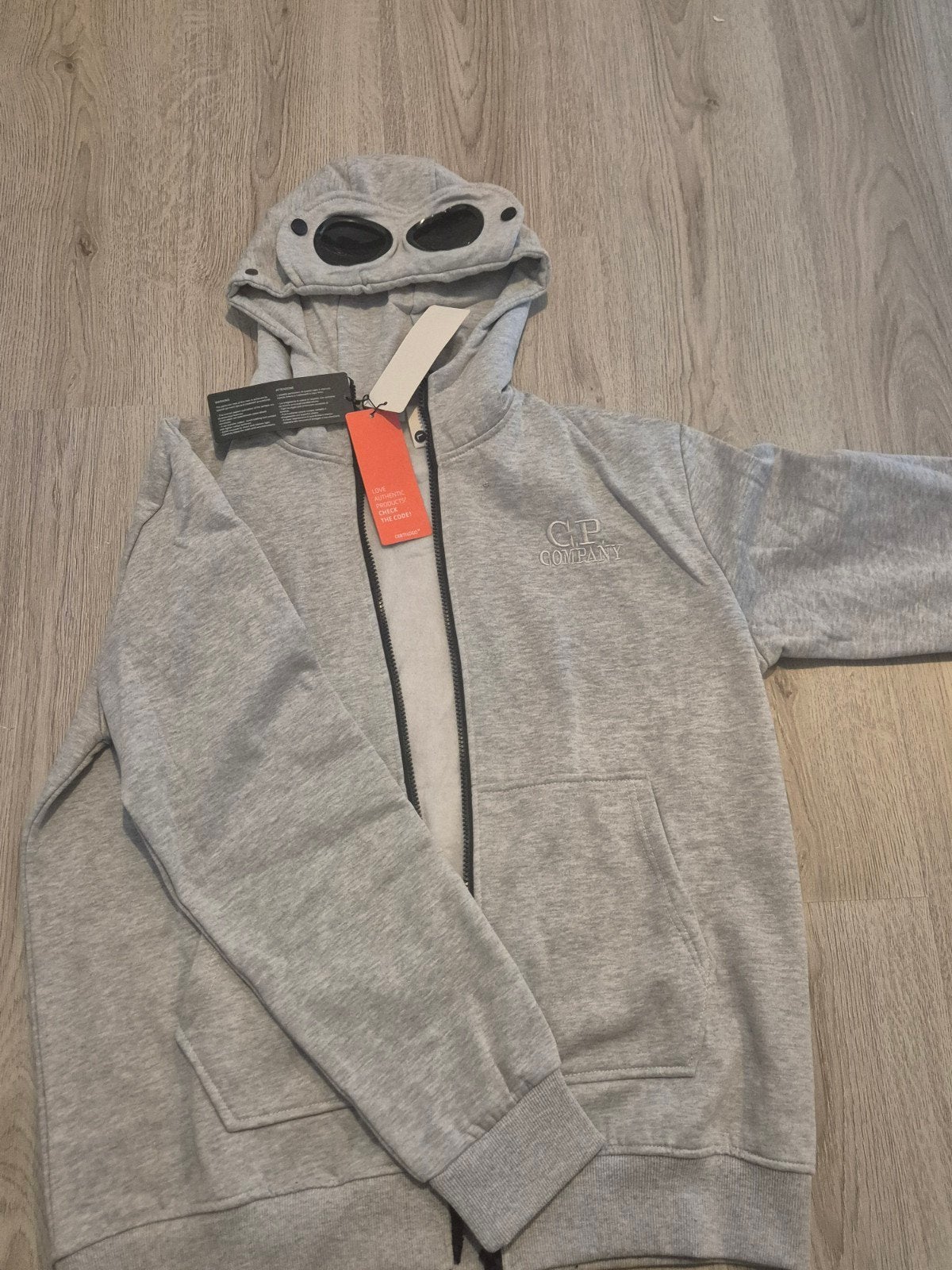 Nieuwe CP Company Goggle Hoodie - Grijs, Maat 52/54 (L), CP Company, Nieuw, Ophalen of Verzenden
