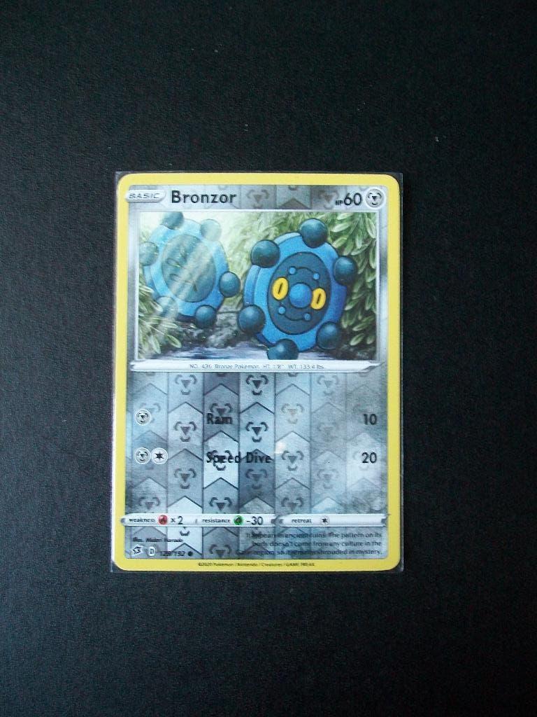 1302. Nieuwe Pokemon Kaart holofoil BRONZOR hp 60 (129/192), Verzenden, Nieuw, Losse kaart, Foil